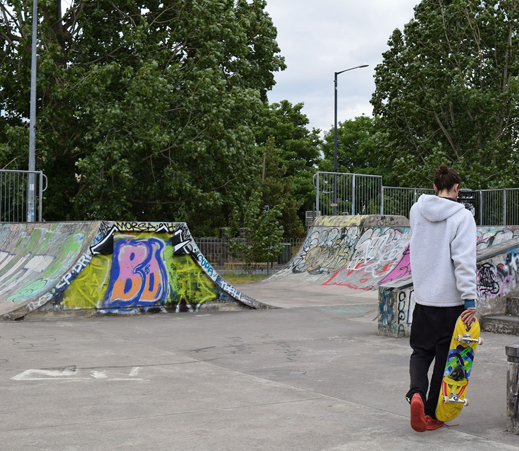Chester walking through a skatepark