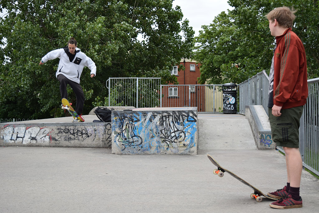 Chester performing a trick with Fred watching