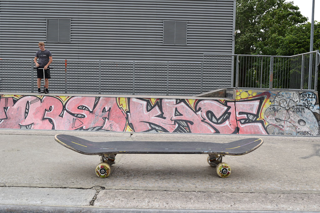 A skateboard resting on a ramp